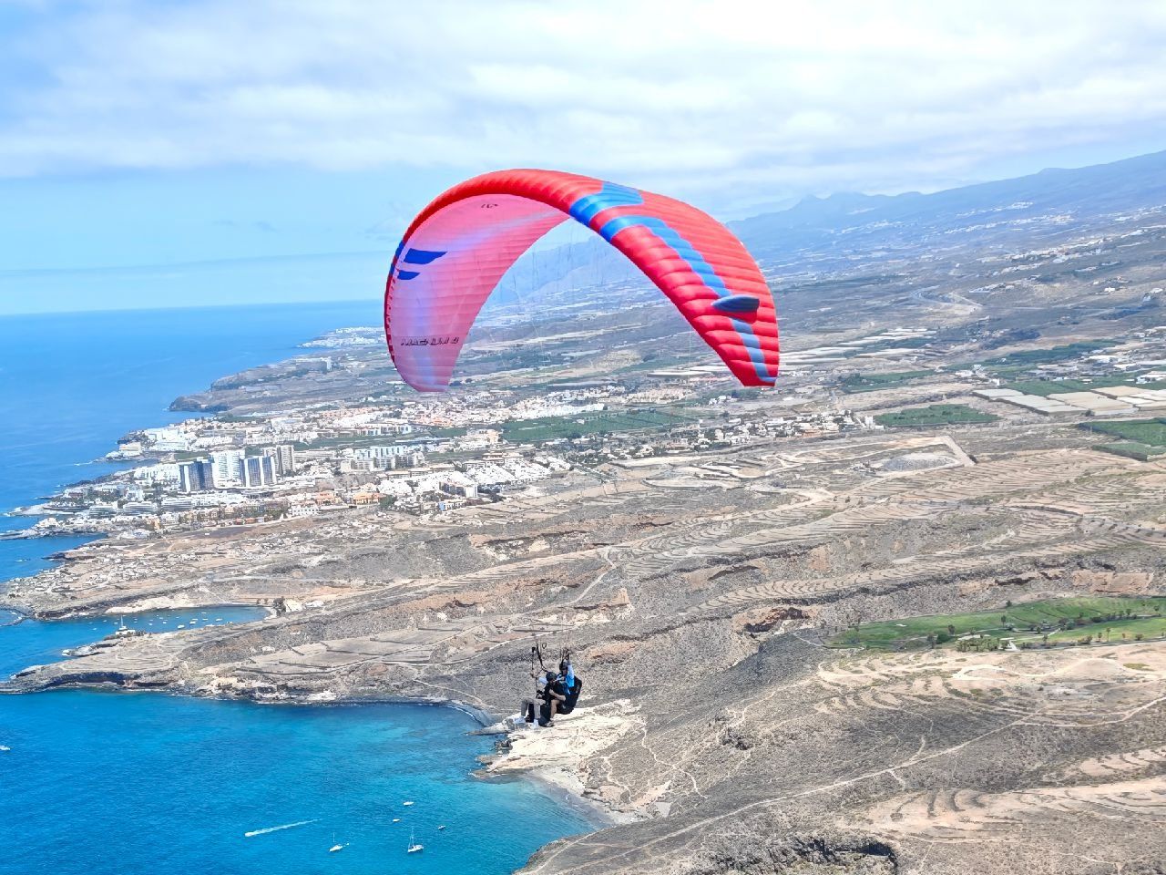 Tandem paragliding flight over Costa Adeje with a Sky of Tenerife pilot